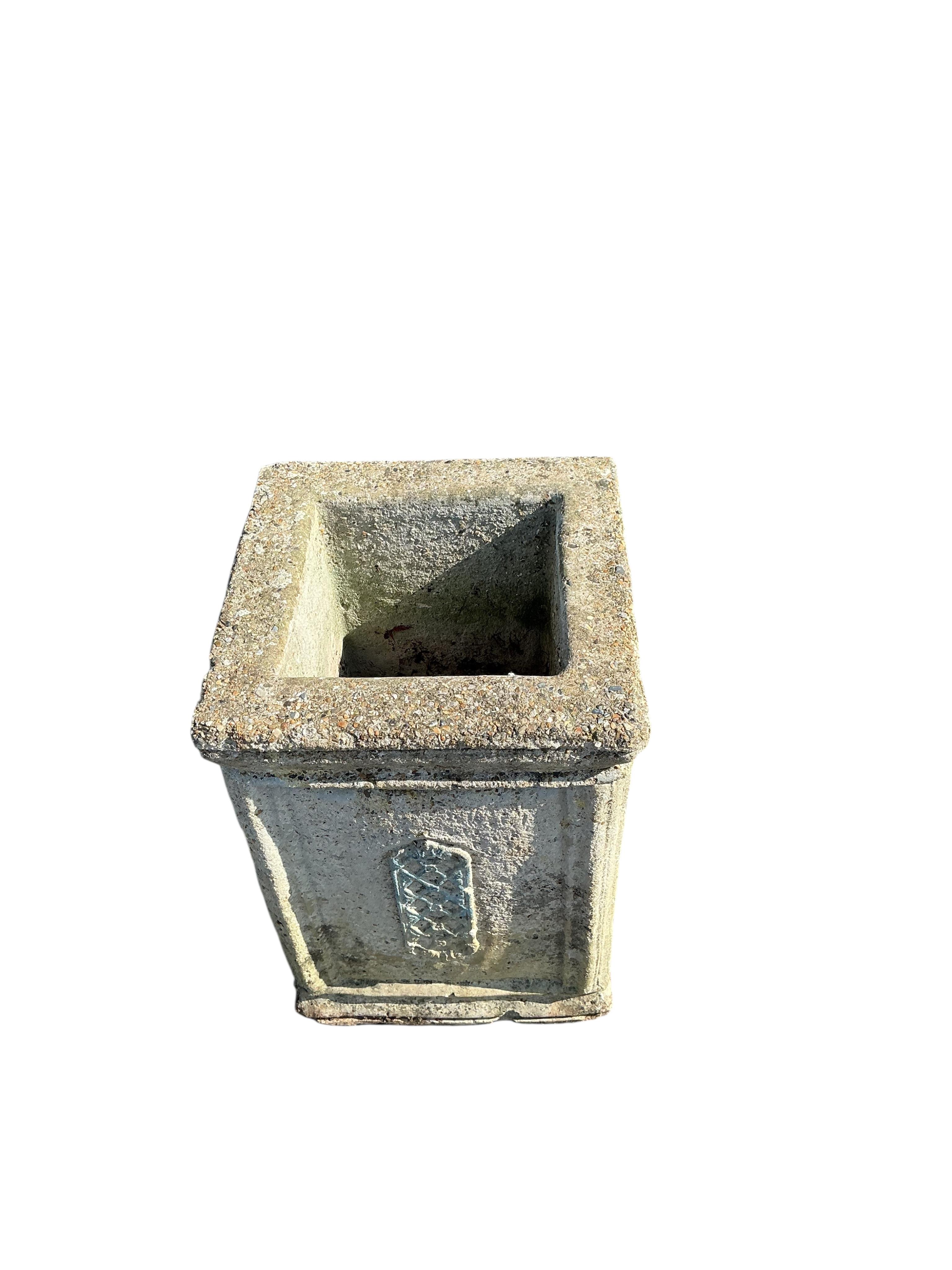 A square reconstituted stone garden planter, 36cm, height 50cm